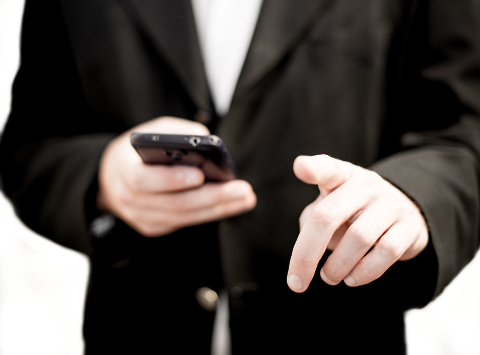 17744-business-man-holding-a-cell-phone-pv